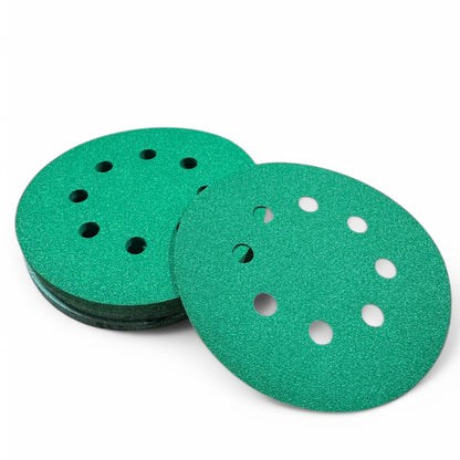Green aluminum oxide 5 inch (125mm) 8-hole sanding discs, one face up on a stack