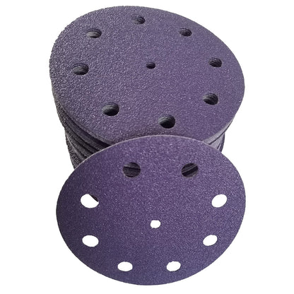 Stack of purple ceramic 5 inch 9-hole sanding discs with one disc face up