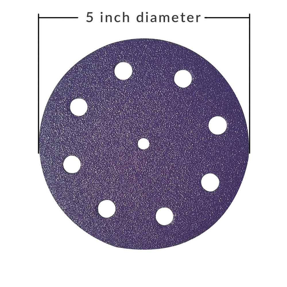 Diagram showing the 5 inch (125mm) diameter of a purple ceramic 9-hole sanding disc