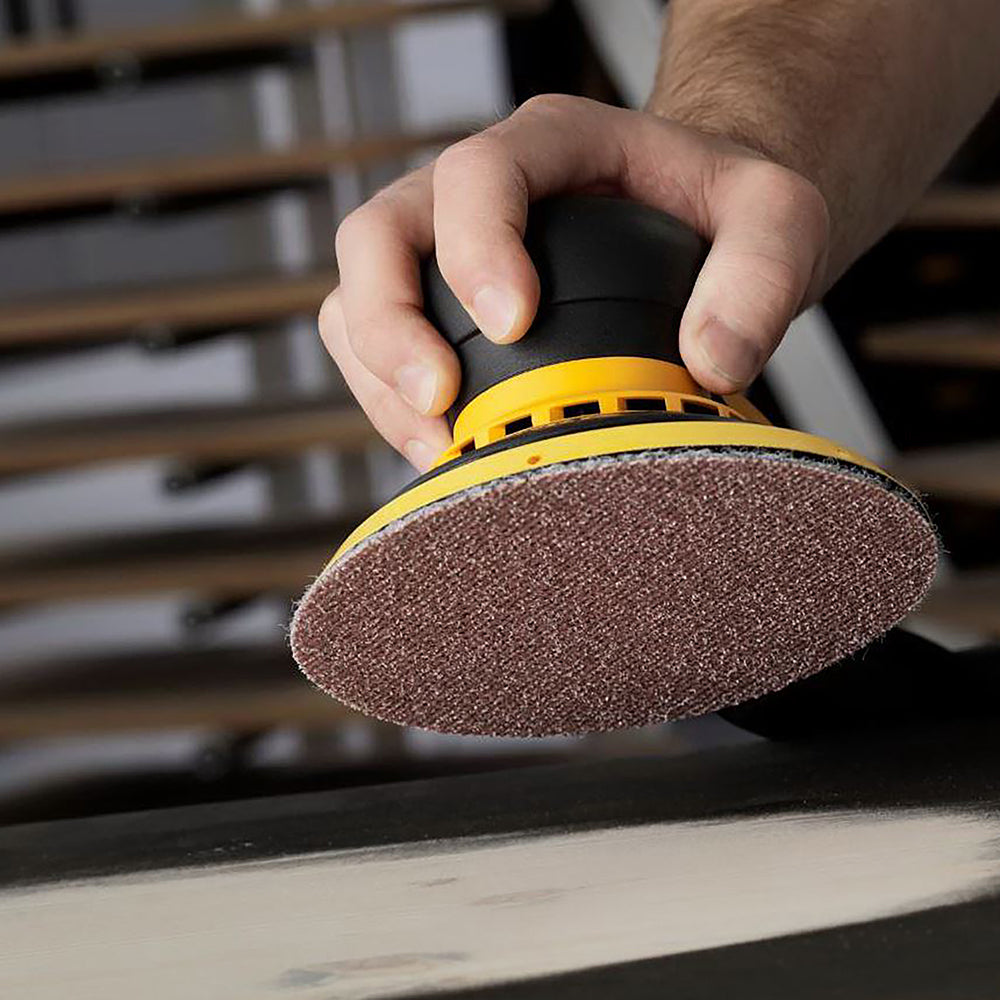 Ceramic mesh sanding disc fitted to a 6 inch random orbital sander with dust extraction connected